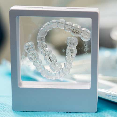 Invisible aligner orthodontic treatment